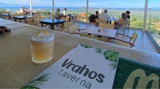 Breathtaking sunset view from the cliffside terrace of Vrahos Taverna