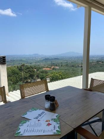 Breathtaking sunset view from the cliffside terrace of Vrahos Taverna