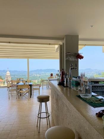 Breathtaking sunset view from the cliffside terrace of Vrahos Taverna